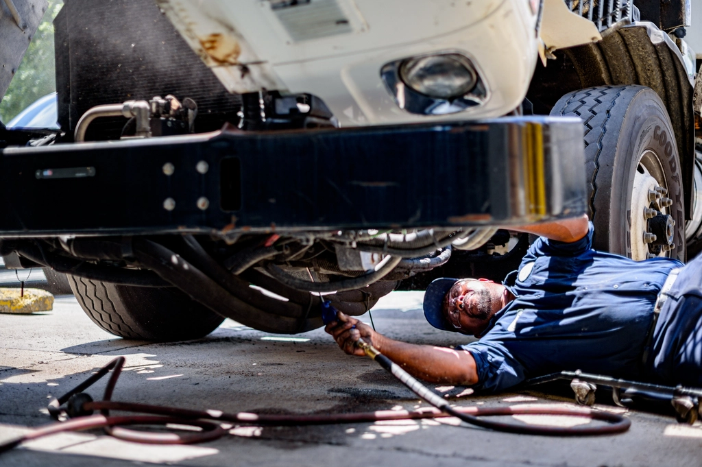 Technician working under a vehicle